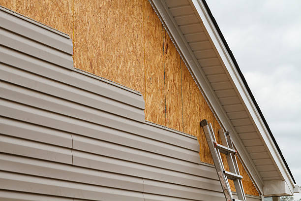 Professional Storm Damage Siding Repair technician working in Sherborn, MA